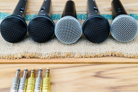 microphone on sack wooden background