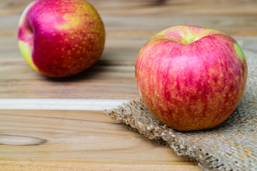 apple on sack wood background