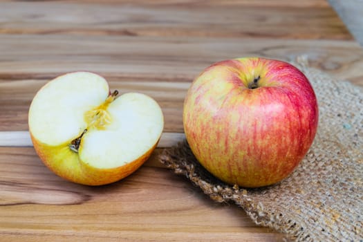 apple on sack wood background