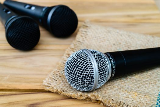 microphone on sack wooden background