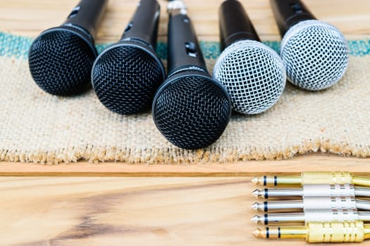 microphone on sack wooden background