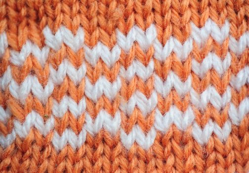 Orange texture with white inserts knitted fabric for the background