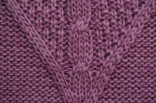 texture of lilac knitted fabric for the background.