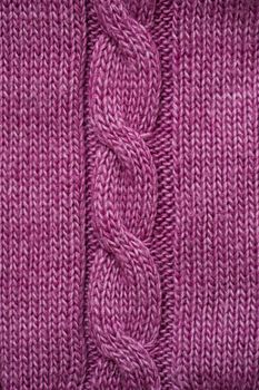 texture of lilac knitted fabric for the background.