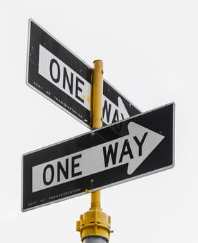 a couple of isolated one way sign