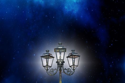 Antique candelabrum, lantern against a beautiful starry sky.