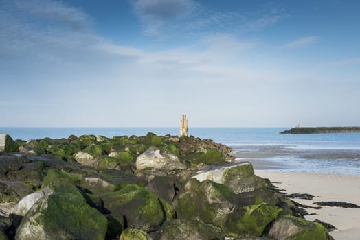 blue sky and rocks on the beach near the sea