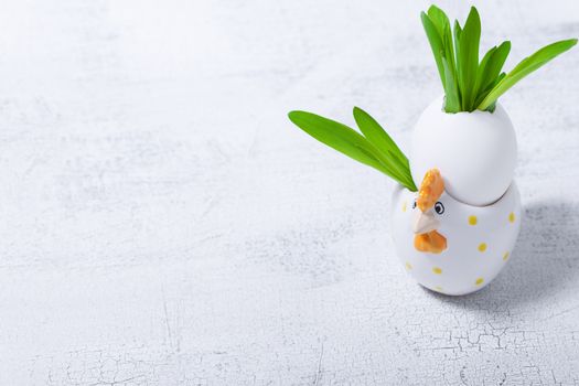 Egg with flowers on a white background. Easter Symbols.