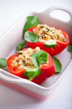 Stuffed red peppers filled with quinoa and vegetables