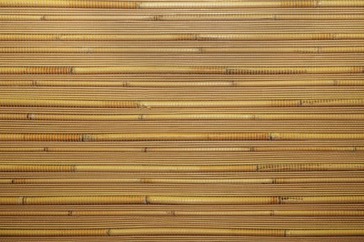 Dry reeds texture. Organic nature wallpaper of yellow cane. Natural warm wooden background with bamboo and straw