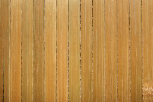Dry reeds texture. Organic nature wallpaper of yellow cane. Natural warm wooden background with bamboo and straw