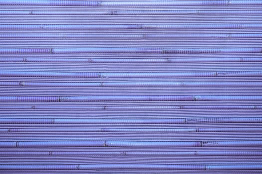 Dry reeds texture. Organic nature wallpaper of purple cane. Natural warm wooden background with bamboo and straw