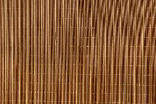 Dry reeds texture. Organic nature wallpaper of yellow cane. Natural warm wooden background with bamboo and straw