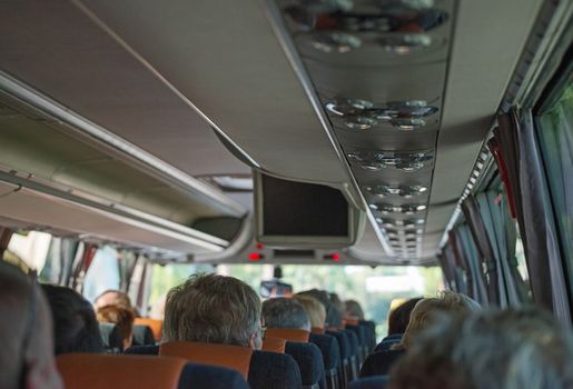 View from inside the bus with passengers.