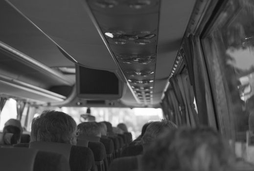 View from inside the bus with passengers.