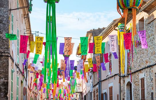 Street decorated with colorful signs.