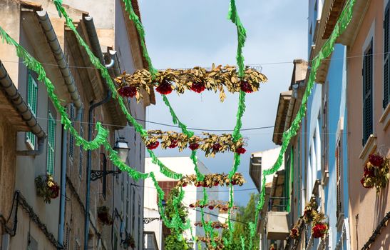 Street decorated with colorful ribbons.