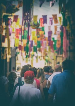 People walking during festival on the street.