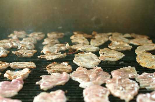 Meat steak barbecue on the grill outdoors.