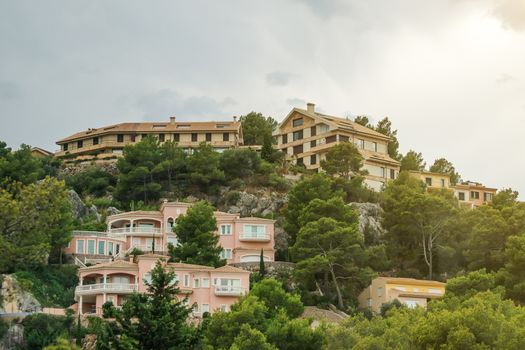 Houses in the green mountain hills.