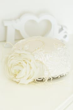 female white wedding hat with wooden word Love on background
