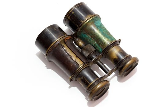 Vintage binoculars on white background