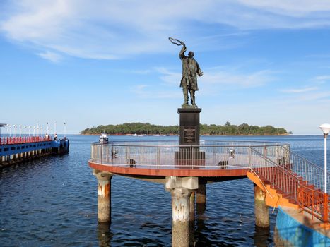 Statue of Late Rajiv Gandhi (Youngest Indian Prime Minister from 1984 to 1989) at water sports complex with Ross Island in the background, Port Blair, Andaman and Nicobar Islands, India, Asia.