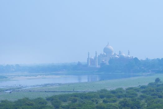 The Taj Mahal and river Yamuna viewed from Red Fort, Agra, India.