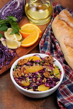 red coleslaw salad with slices of oranges and walnuts