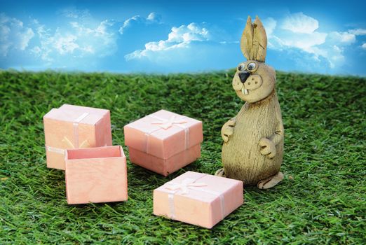 Easter. Brown Easter Bunny with pink gift box