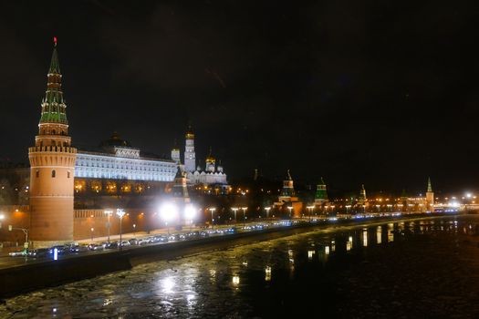 The Kremlin and the Moscow river at night in winter