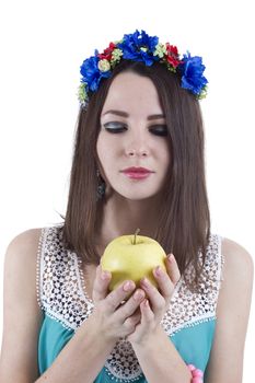 Pretty woman with an apple in his hand on a white background