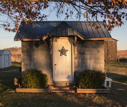 A warmly lit shed on a farm in Kentucky.