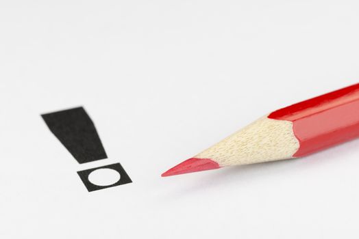 Conceptual visualization of an exclamation point and red pencil as a convinced vote in elections
