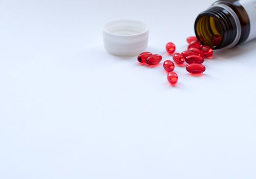 Tabs Vitamins, omega 3, Medications tablets and capsules in a beaker. Medications tablets, suppository bottles, capsules and thermometer on wooden table