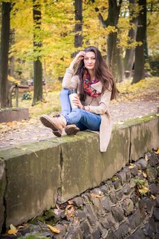 girl sitting on the concrete stone in the Park