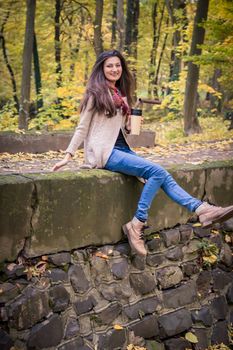 girl sitting on the concrete stone in the Park