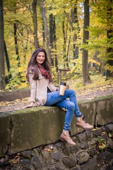 girl sitting on the concrete stone in the Park