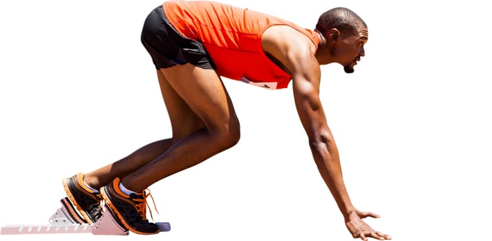 Profile view of runner preparing for the start of a race