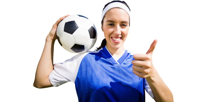 Portrait of happy woman football player holding a football on a white background