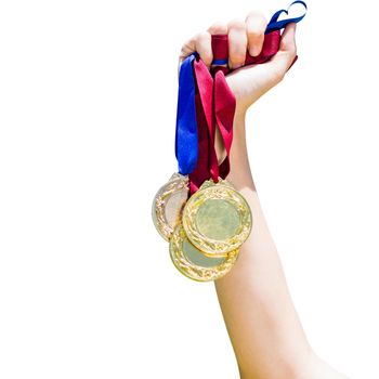 Hand holding three medals on white background