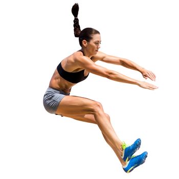 Sportswoman is jumping on a white background