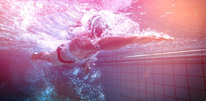 Fit swimmer training by himself in the swimming pool at the leisure centre