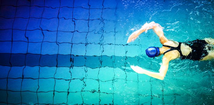 Fit woman swimming in the pool at the leisure center