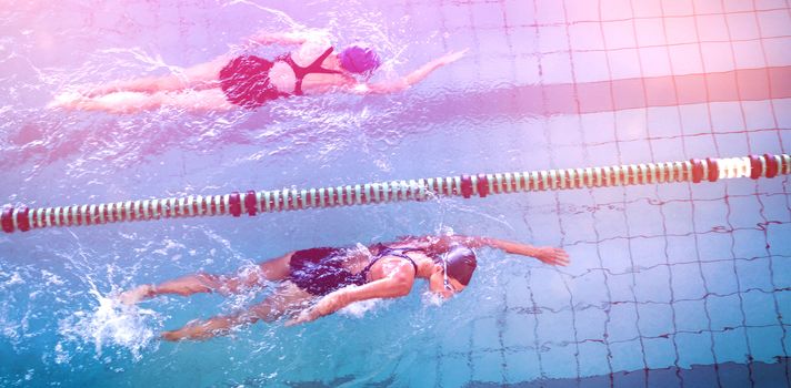 Female swimmers racing in the swimming pool at the leisure center