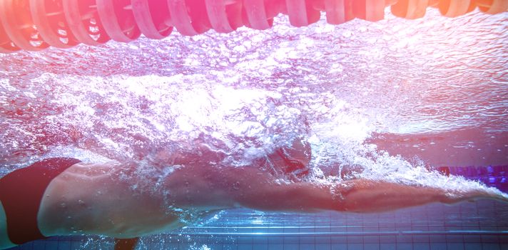 Fit swimmer training on his own in the swimming pool at the leisure centre