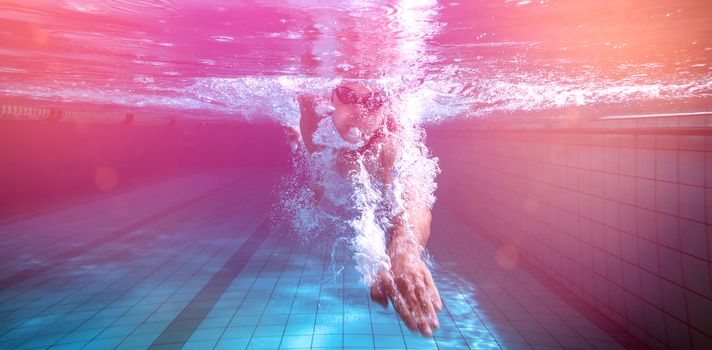 Fit swimmer training by himself in the swimming pool at the leisure centre