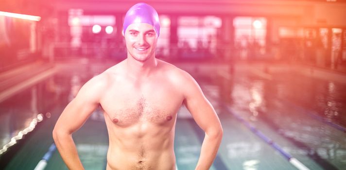 Fit man with hands on hips at the pool
