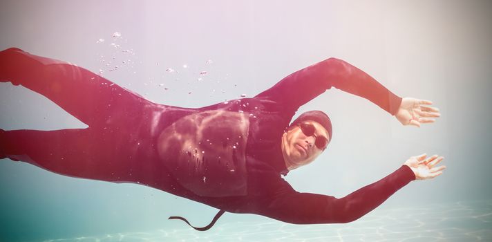 Portrait of young man swimming underwater