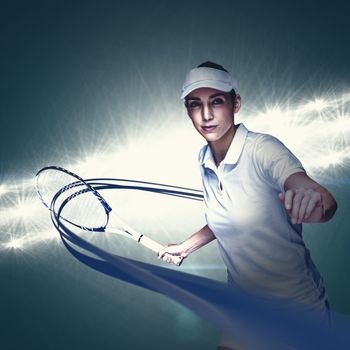 Female athlete playing tennis against spotlight
